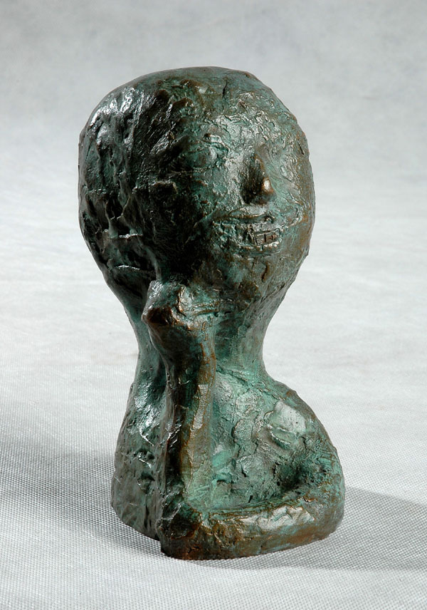 Child head - a sstylized, almost abstract and primitive culpture by Zhang Yaxi