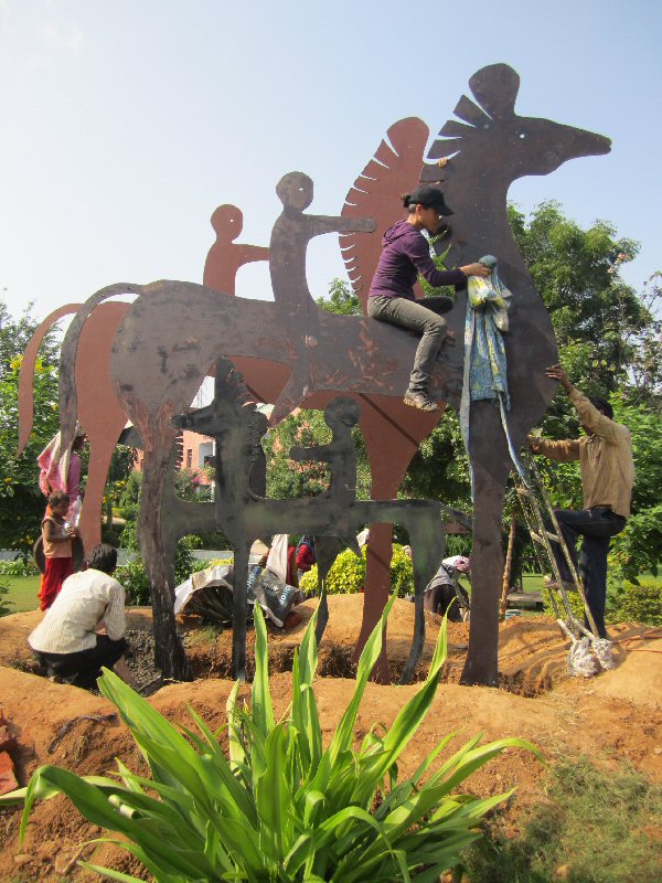 Chinese sculptor Zhang Yaxi and assistants working on "Horses & Riders"