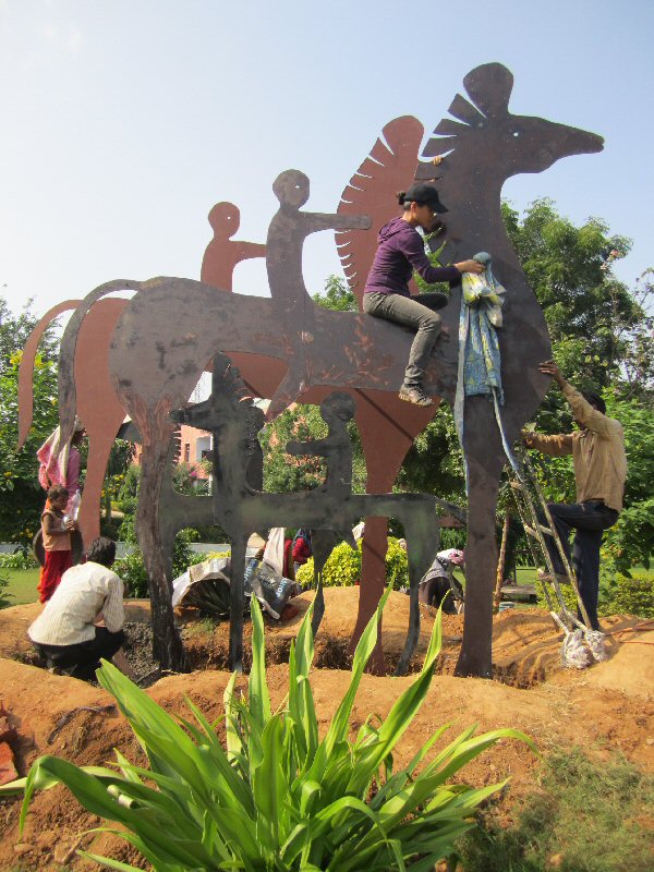 Chinese sculptor Zhang Yaxi and assistants working on "Horses & Riders"
