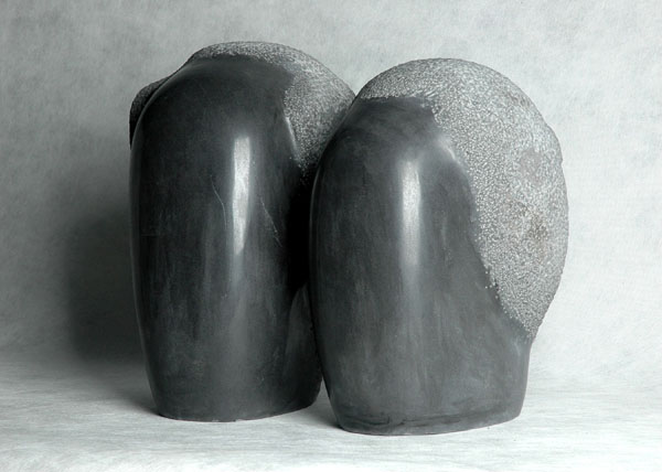 Minimalist Couple - an original black marble carvings by Chinese sculptor Zhang Yaxi - a very contemporary Chinese artwork