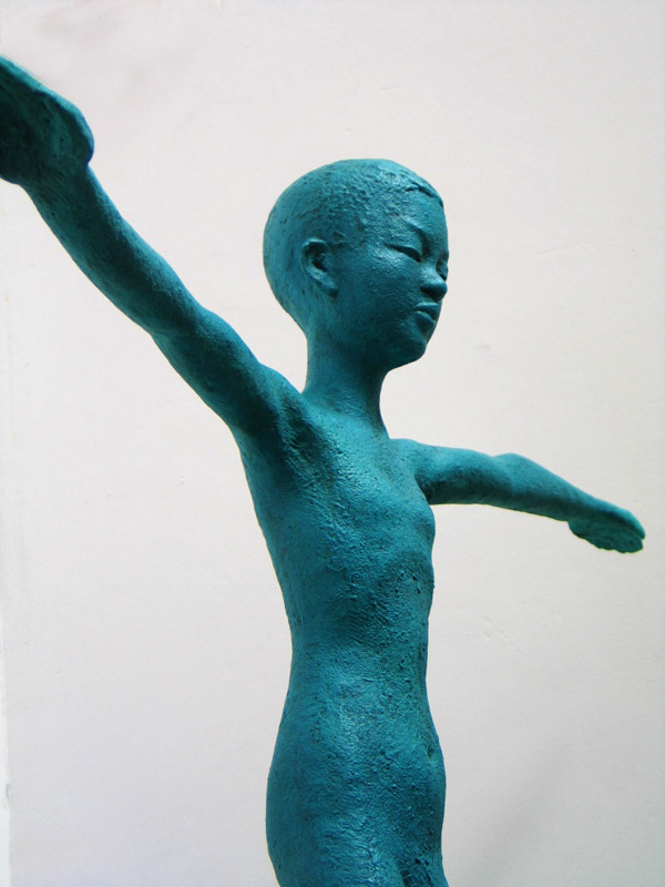 A close-up view of this stylized sculpture of a child - a real hope sculpture