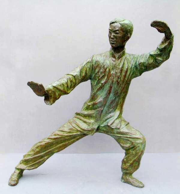 Bronze tai chi sculpture shown in gallery setting