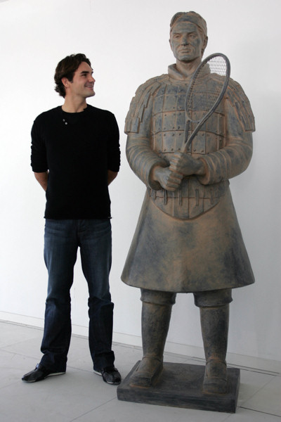 Top tennis player Roger Federer with his Tennis Terracotta Warrior sculpture in Madrid (October 2007)