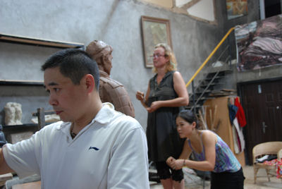 Zhang Yaxi, Shen Xiaonan and Laury Dizengremel working on the Terracotta Warriors of Tennis in their Tank Loft Contemporary Arts Center studio, adjacent to the Sichuan Fine Arts Institute in Chongqing