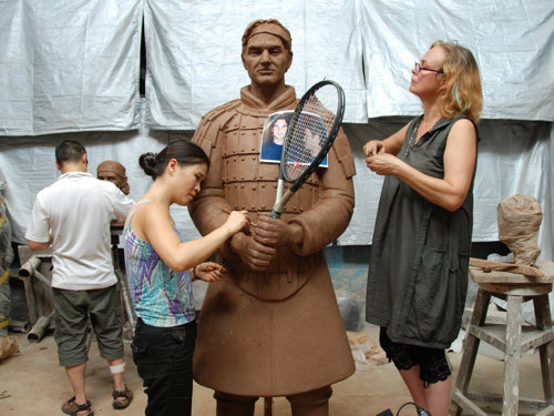 Zhang Yaxi working with fellow sculptors Shen Xiaonan and Laury Dizengremel on the Roger Federer sculpture portrayed as a Tennis Terracotta Warrior in her Tank Loft Contemporary Arts Center studio in Chonqging, Chinq